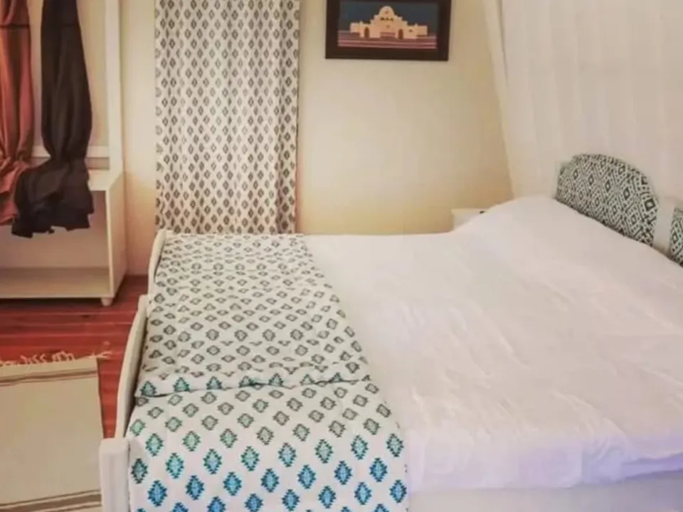 A tent bedroom at Tiniri Camp